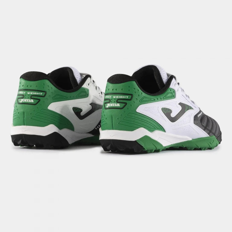Joma Cancha 2401 green turf soccer shoes worn on synthetic field – demonstrating fit, comfort, and performance grip