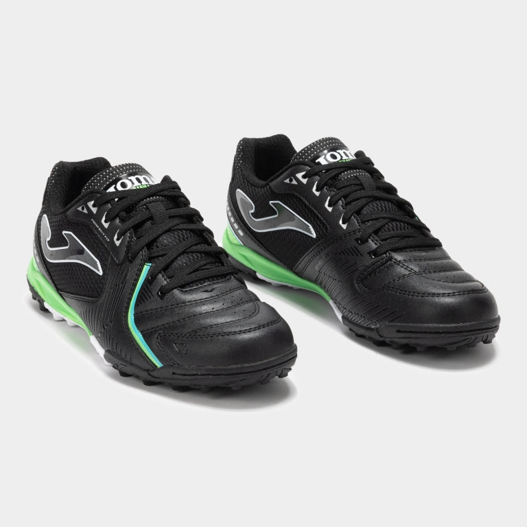 Joma Dribling 2501 black soccer shoes – bottom view of rubber turf outsole with short studs for grip on synthetic fields