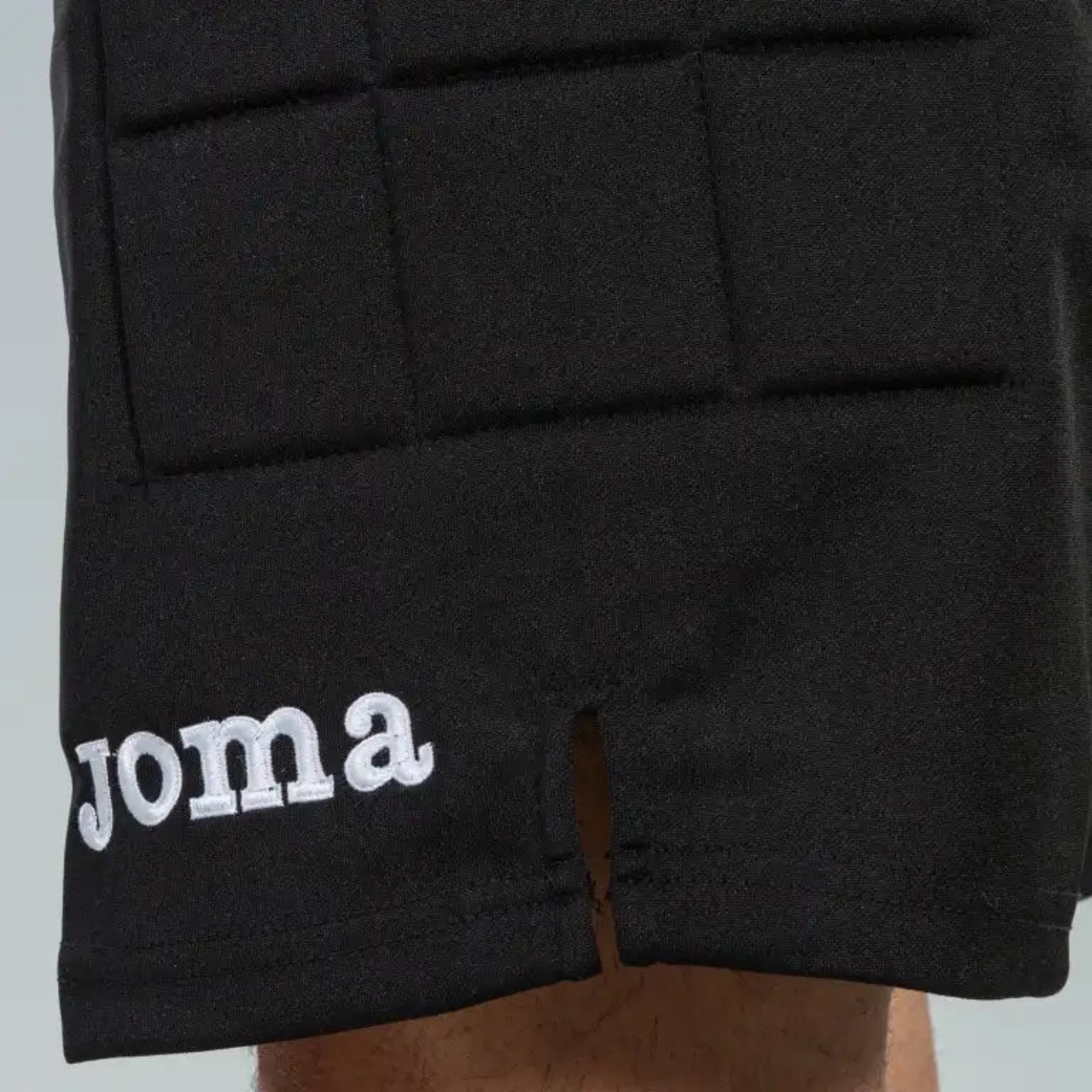 Black shorts protect with 'Joma' logo