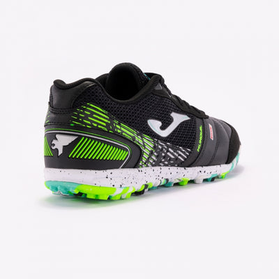 Joma Mundial 2401 black soccer shoes worn on turf field – demonstrating fit and performance grip on synthetic surfaces.