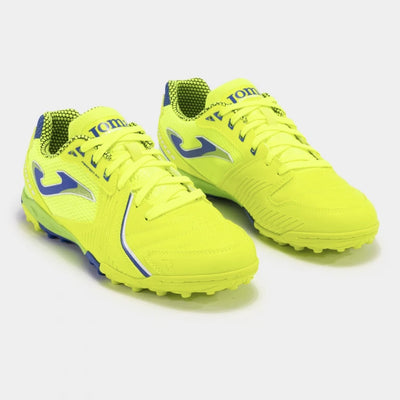 Joma Dribling 2409 yellow turf soccer shoes worn on synthetic field – demonstrating fit, comfort, and performance grip.