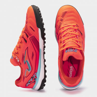 Joma Liga 5 2408 orange turf soccer shoes worn on synthetic field – showcasing fit, comfort, and grip during play.