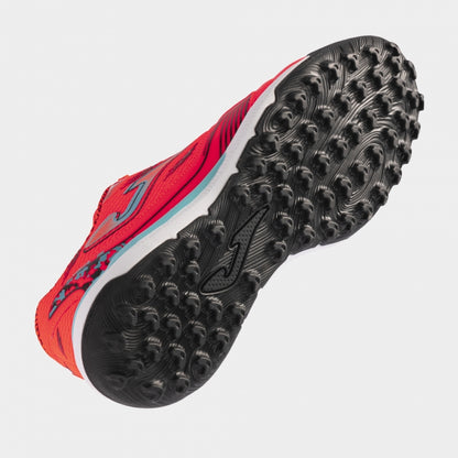 Joma Liga 5 2408 orange soccer shoes – bottom view of rubber turf outsole with short studs for traction on synthetic surfaces.