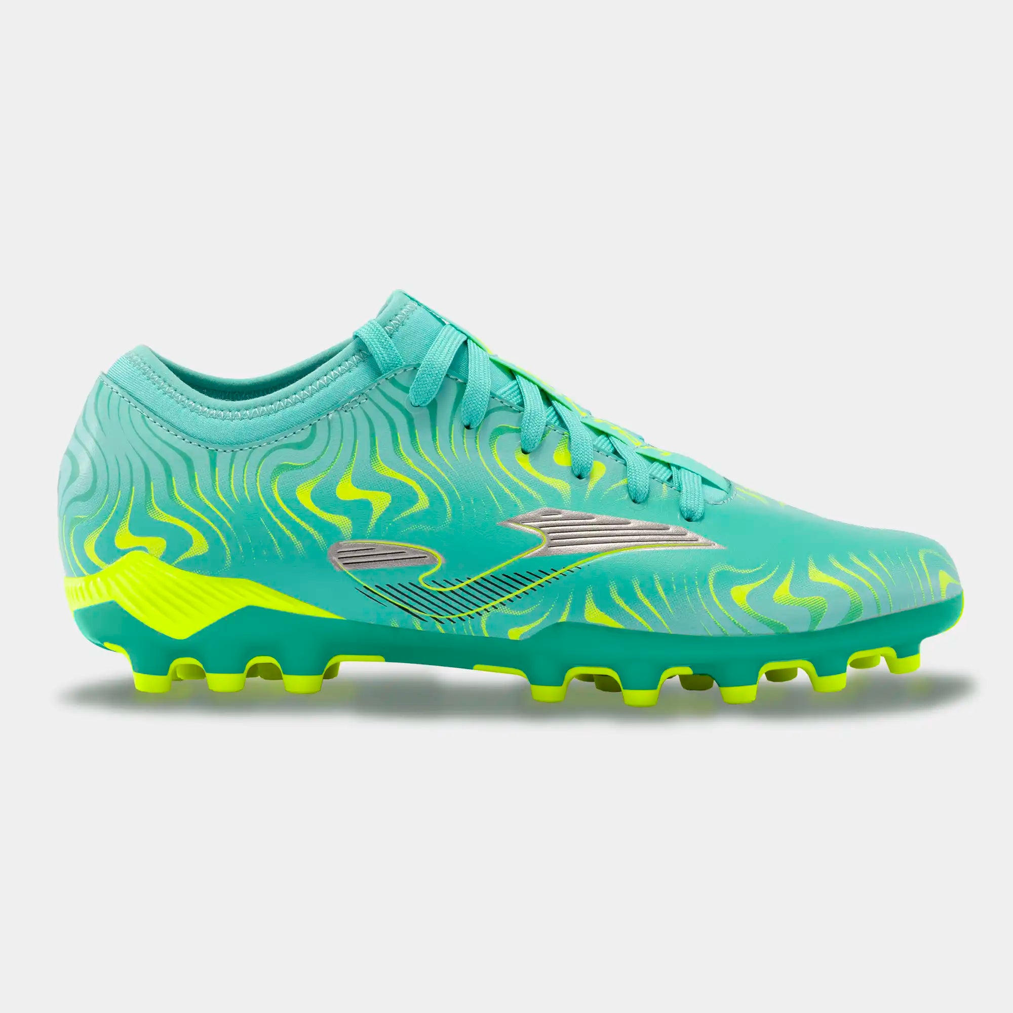 A pair of Joma Evolution 2415 firm ground cleats for football with a synthetic leather upper and a geometric pattern in green and yellow colors.
