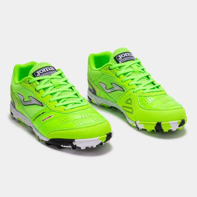 Joma Mundial 2511 green fluor turf soccer shoes worn on synthetic field – showing fit, comfort, and grip.