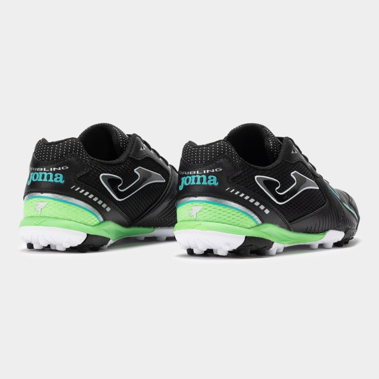 Joma Dribling 2501 black turf soccer shoes worn on turf field – showcasing fit, comfort, and traction