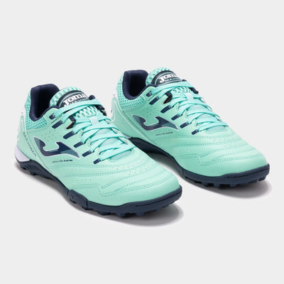 Joma Maxima 2527 turquoise turf soccer shoes worn on synthetic field – showcasing fit, comfort, and grip.