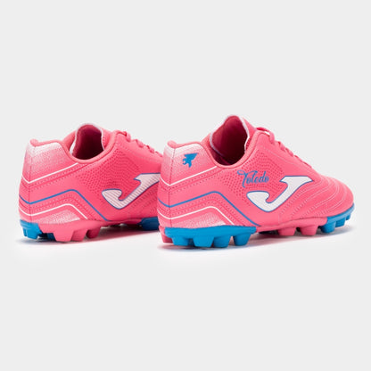 Pink soccer cleats with blue soles